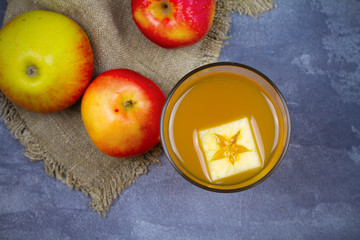 Apple cider and fruits on grey background. overhead, horizontal