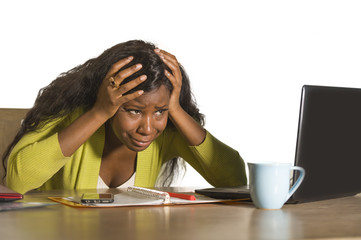 close up portrait of young sad and depressed black afro American business woman crying while...