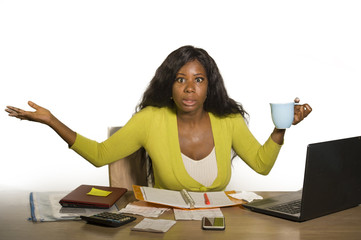 young attractive stressed and overworked black African American woman working upset and desperate...