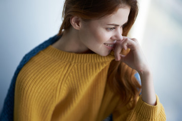 beautiful woman in yellow sweater top view