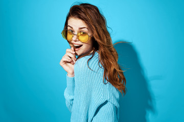 happy woman with glasses looking at the camera