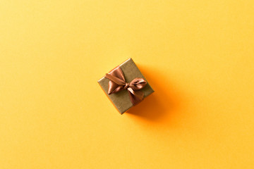 A small gift on a light background. The concept of a gift made with your own hands