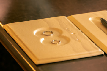 Wedding rings lie on a tray for the wedding ceremony. Concept: wedding and wedding ceremony