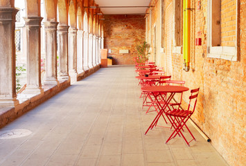street with cafe tables in Venice, Italy