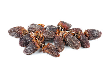 Pile of sun-dried persimmon fruits isolated on white background