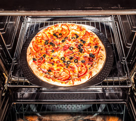 Appetizing pizza in the oven.