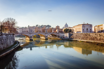 Fototapeta na wymiar Spectacular view on the ancient bridge over the river in Rome