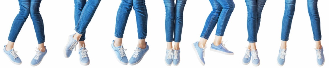 panorama set of female legs in the different poses in jeans and sneakers isolated on white...