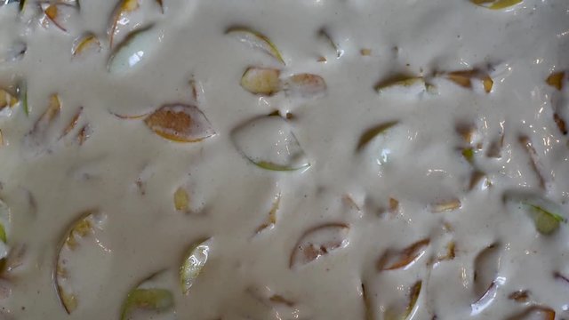 Spread the last layer of apples on the prepared dough for baking Apple pie Charlotte of fresh fruit