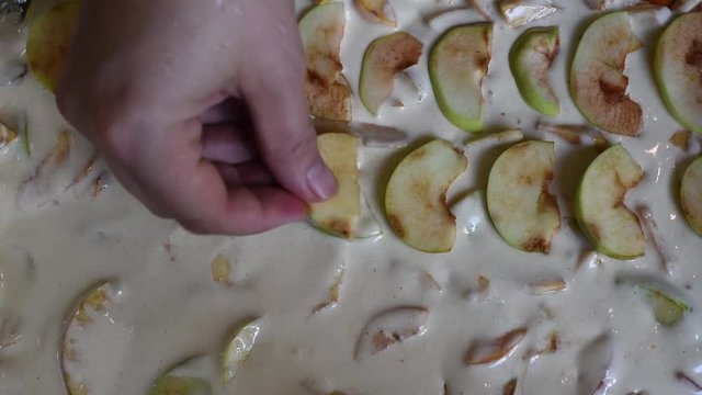 Spread the last layer of apples on the prepared dough for baking Apple pie Charlotte of fresh fruit