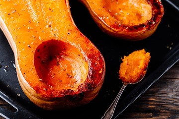 Baked butternut squash pumpkin, ingredient for a warm fall soup.