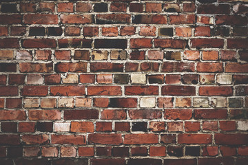 Old red brickwall texture with broken bricks