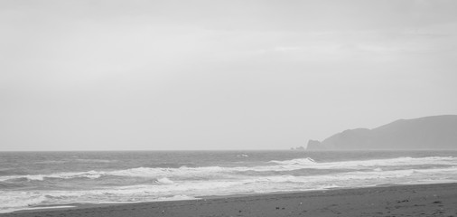 The incredible seascaping view of beach with blue sea in morocco in summer  in Al hoceima in black and white