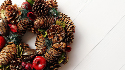 Christmas Wreath on White Wooden Background, Top View, Flat Lay, Winter Holidays Concept.