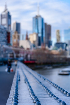 The high rise buildings of Melbourne Australia in the distance from the  perspective of Sandridge Bridge over the Yarra River. Stock Photo | Adobe  Stock