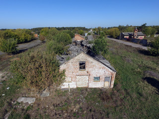 Fototapeta na wymiar Drone quadrocopter with high resolution digital camera explores an abandoned huge milk farm near Chernobyl area