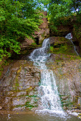 Photo of high waterfall in the mountains