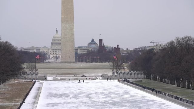 Winter Washington DC: washington monument and US Capitol at snowy day