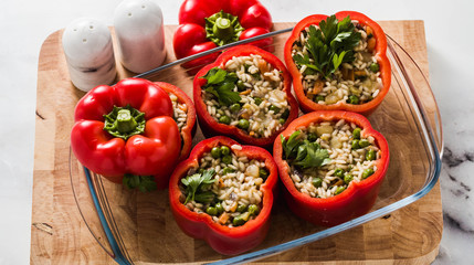 banner of Stuffed peppers in a glass baking dish, ready for baking in the oven. healthy vegan cuisine for the whole family. comfort food