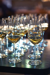 Lots of full champagne and wine glasses