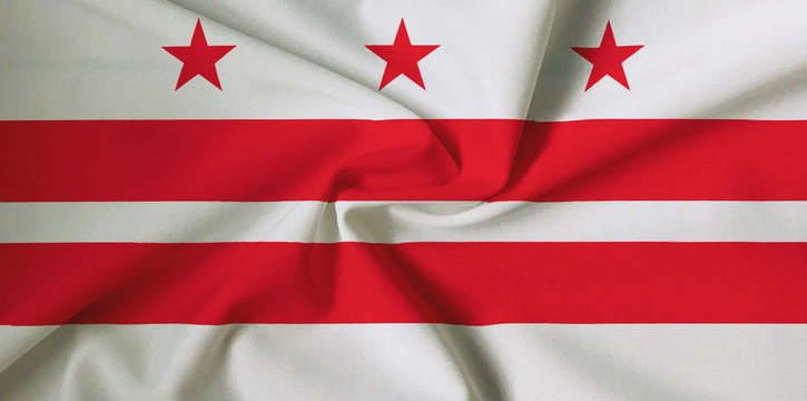 National flag of Washington DC - United States of America on a waving cotton texture background