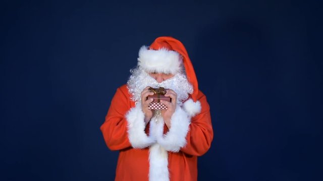 Funny fat santa claus and gift. 