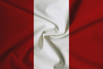 National flag of Peru on a waving cotton texture background