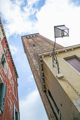 Fototapeta na wymiar A streetlight lamp on a historic building in Venice, Italy, Europe.