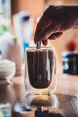 Mixing coffee in the kitchen