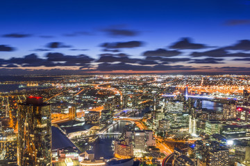 Aerial view of dramatic night sky with crescent moon at Melbourne city skyline