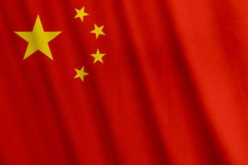 Waving Chinese flag with a fabric texture