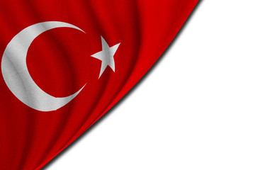 Waving national flag of Turkey on a white wall texture background