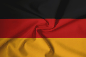 Obraz premium Waving German flag with a fabric texture