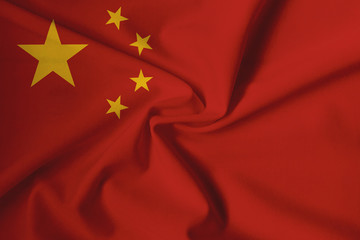 Waving Chinese flag with a fabric texture