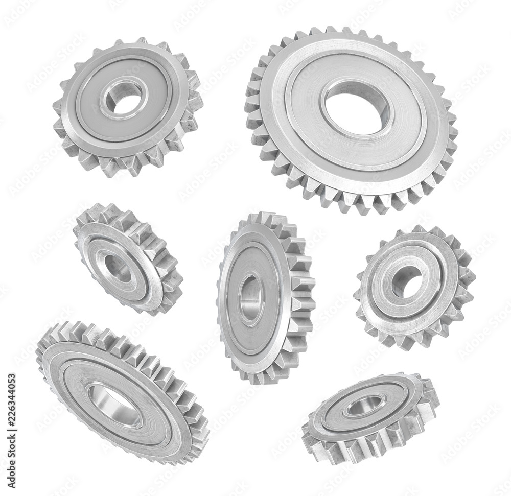 Fototapete 3d rendering of several metal spur gears hanging in different angles on a white background.