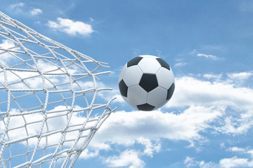 Naklejka premium 3d rendering of a football ball flying very strongly through a net and breaking it on a sky background.