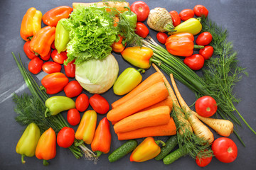Fototapeta na wymiar A rich variety of autumn colorful bright and fresh vegetables and roots.
