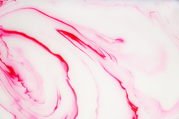 Abstract colored marble background. Stains of paint on the water.
