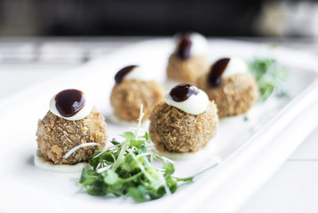 gourmet organic scotch quail eggs starter snack on table