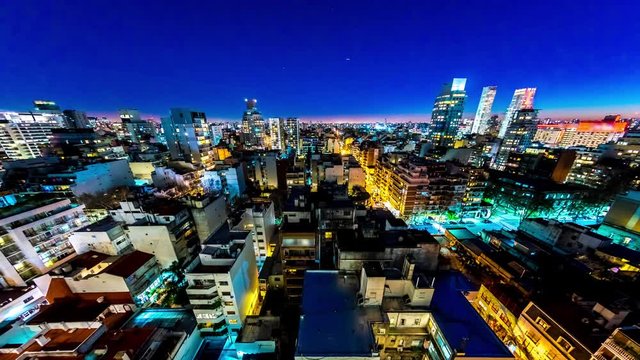 Night time-lapse view on the skyline of the city from a balcony of a high rise apartment in Buenos Aires, Argentina.
