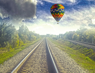 Railway going into the distance, balloon takeoff