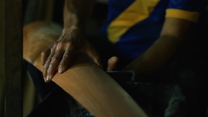 Artisan Heating the Wood in the Fire. Craft Workshop of Harps in Asuncion, Paraguay. Close-Up. Full HD. 
