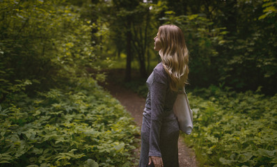 Outdoors portrait of beautiful young woman. Selective focus.