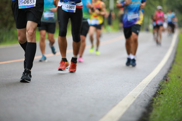 Group of people running race marathon