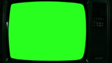Old Television with Green Screen. Black and White Tone. Ready to Replace Green Screen with Any Footage or Picture you Want. You Can Do it With “Keying” (Chroma Key) Effect. Zoom Out. Close-Up. Full HD