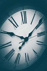 Vintage roman clock face close up. Clock hand close up, time concept.
