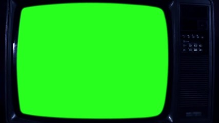 Old Television with Green Screen. Night Tone. Ready to Replace Green Screen with Any Footage or Picture you Want. You Can Do it With “Keying” (Chroma Key) Effect. Zoom Out. Close-Up. Full HD. 