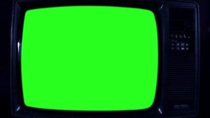 Old Television with Green Screen. Night Tone. Ready to Replace Green Screen with Any Footage or Picture you Want. You Can Do it With “Keying” (Chroma Key) Effect. Zoom In. Close-Up. Full HD. 