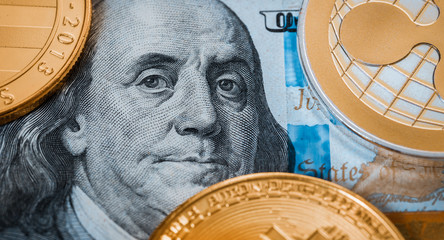 cryptocurrency and hundred dollar bills