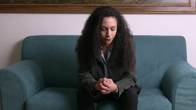 pensive worried young business woman thinking - portrait